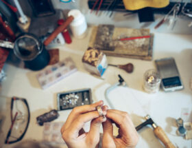 different goldsmiths tools on the jewelry workplace. jeweler at work in jewelry.